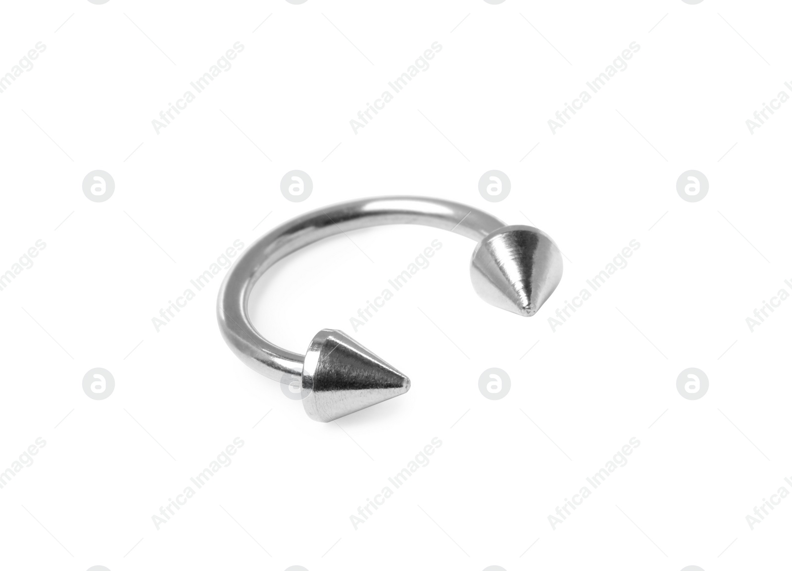 Photo of Piercing jewelry. Circular barbell isolated on white