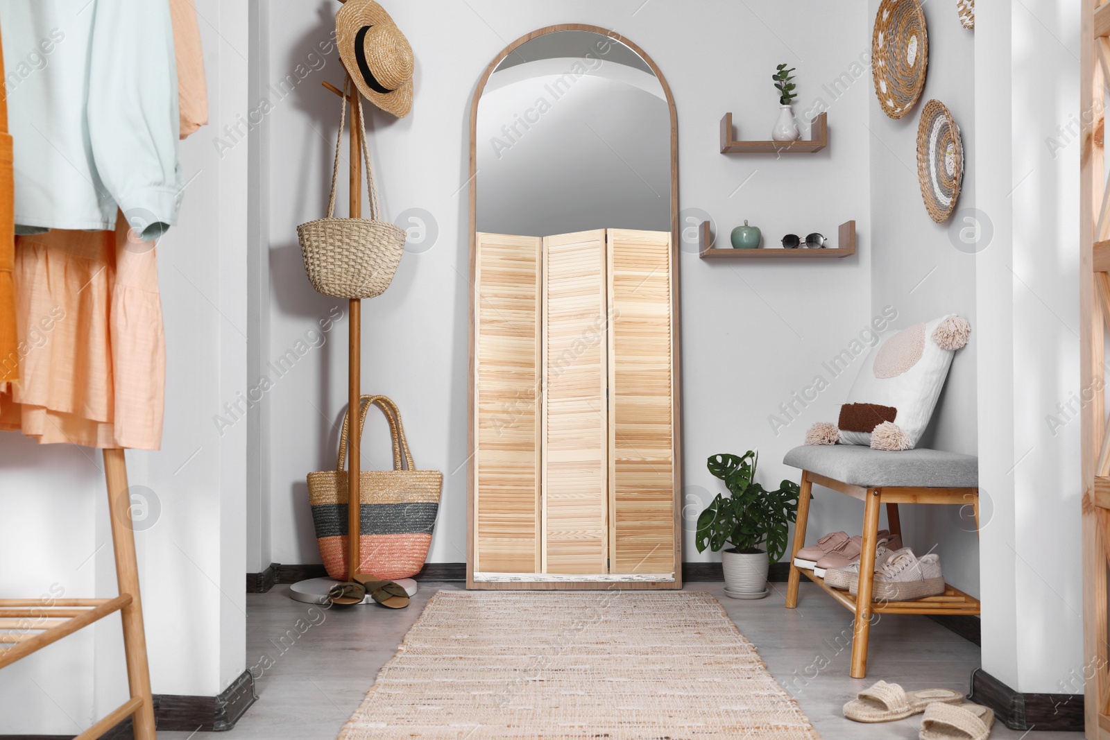 Photo of Hallway interior with stylish furniture and floor mirror