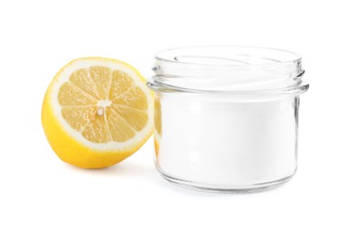 Photo of Baking soda in jar and lemon isolated on white