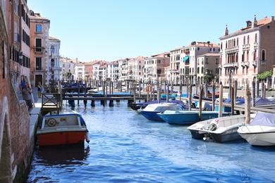 VENICE, ITALY - JUNE 13, 2019: Picturesque view of Grand Canal with boats at pier