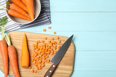 Photo of Flat lay composition with cut carrot on color background. Space for text
