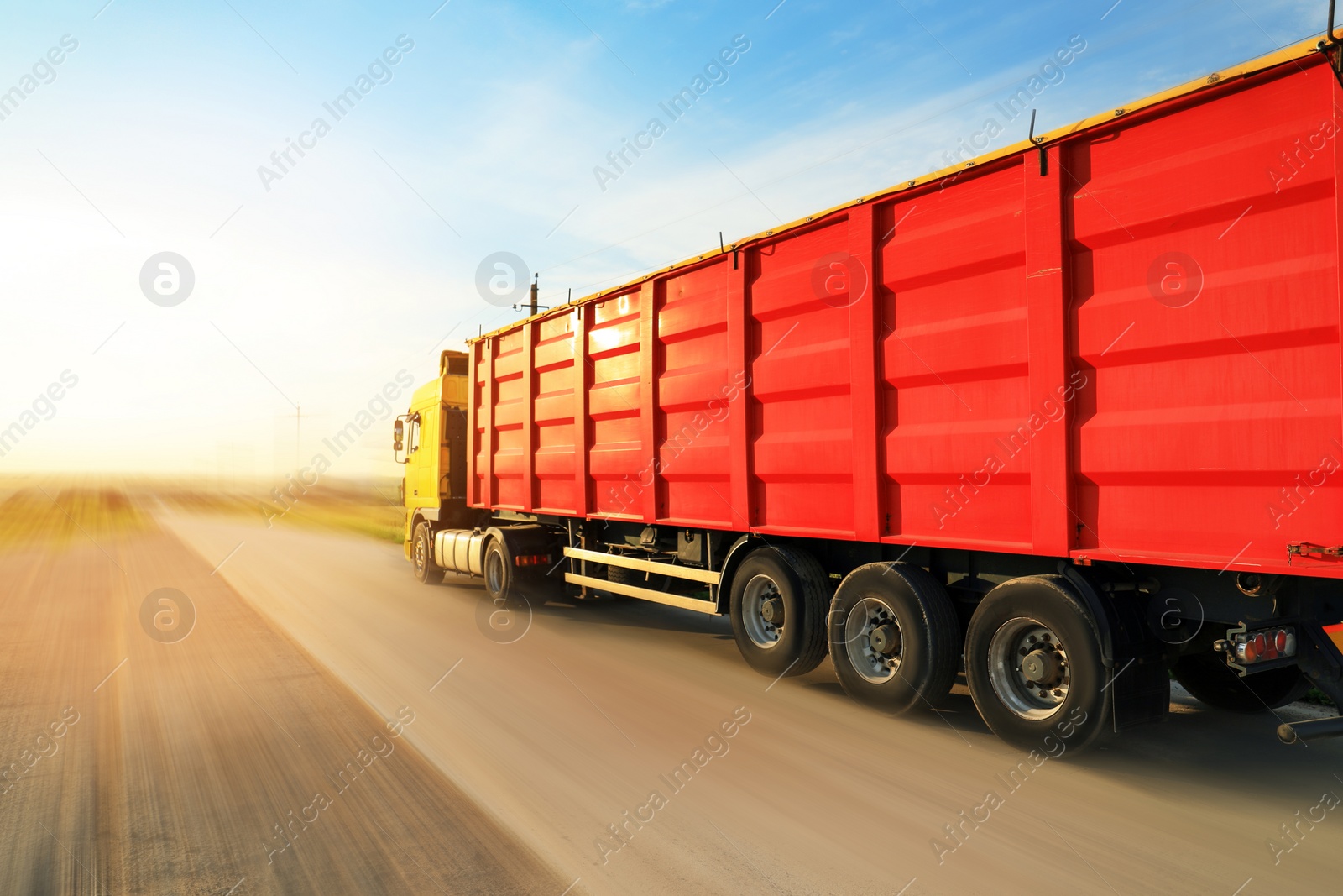 Image of Logistics concept. Truck on country road, motion blur effect 