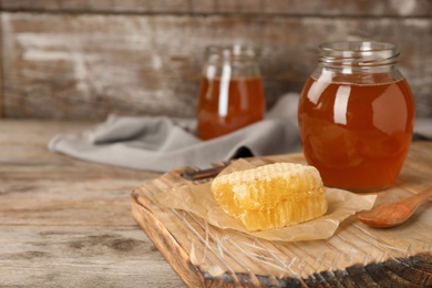 Photo of Composition with tasty fresh honey on wooden board