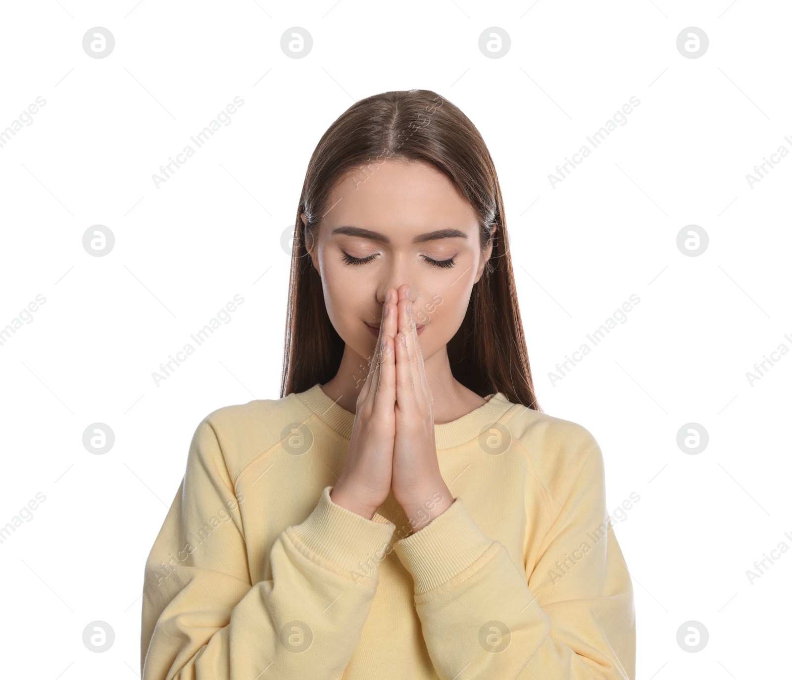 Photo of Woman with clasped hands praying on white background