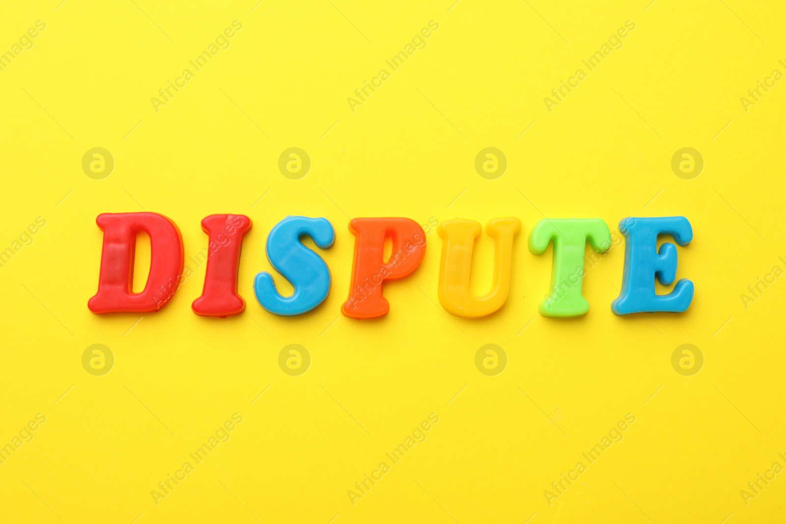 Photo of Word Dispute made of colorful letters on yellow background, flat lay