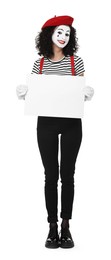 Funny mime with blank sign posing on white background