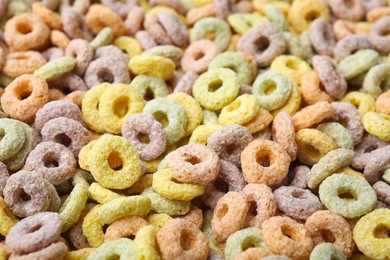 Photo of Tasty cereal rings as background, closeup view