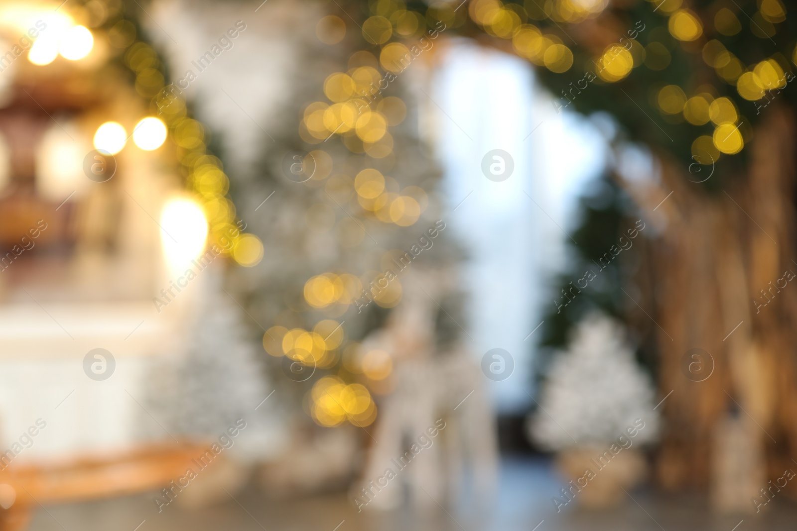 Photo of Blurred view of stylish room interior with Christmas tree and festive decor