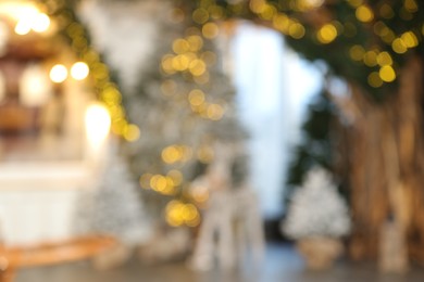 Blurred view of stylish room interior with Christmas tree and festive decor