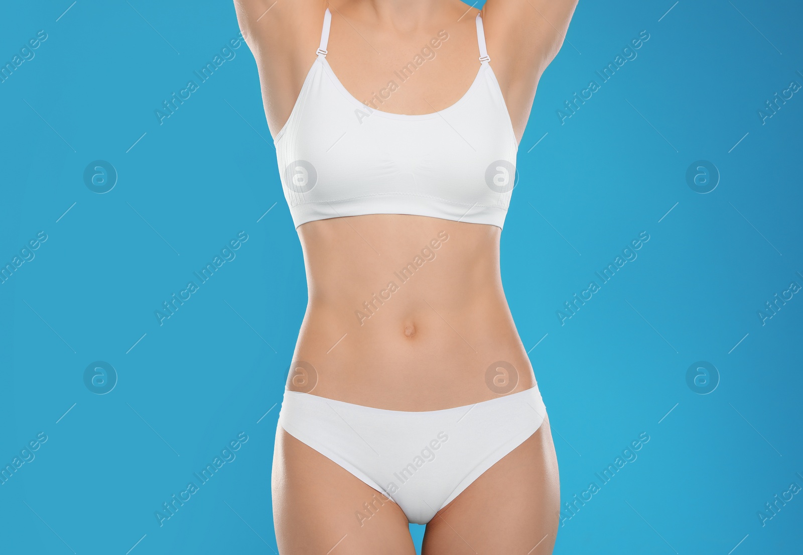 Photo of Slim young woman with smooth gentle skin on color background. Beauty and body care concept