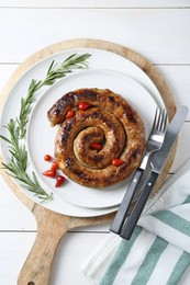 Tasty homemade sausages served on white wooden table, flat lay