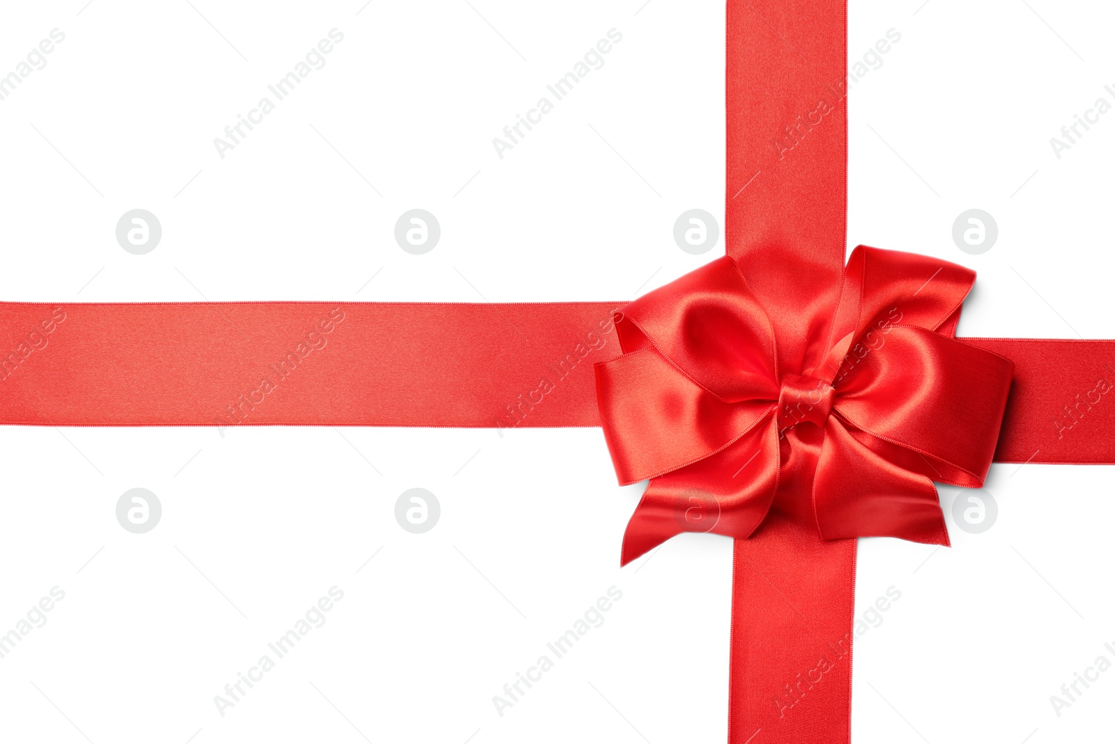 Photo of Red ribbon with bow on white background. Festive decoration