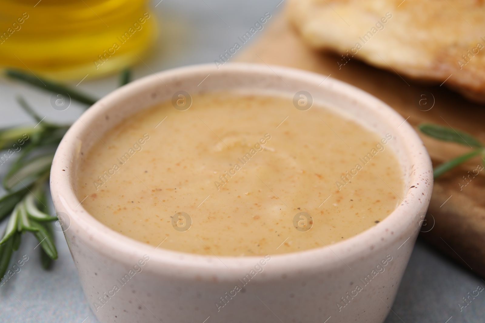 Photo of Delicious turkey gravy in bowl on table, closeup