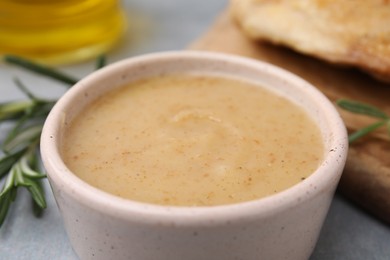 Photo of Delicious turkey gravy in bowl on table, closeup