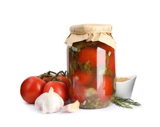Photo of Pickled tomatoes in glass jar and products on white background