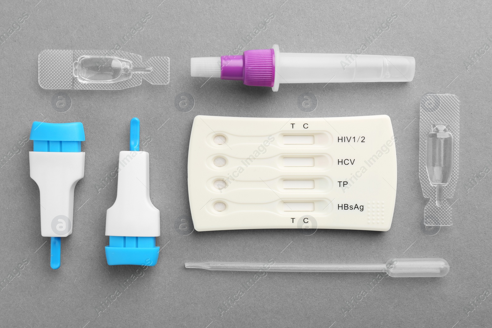 Photo of Disposable multi-infection express test kit on grey background, flat lay