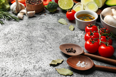 Photo of Fresh products on grey table, space for text. Healthy cooking