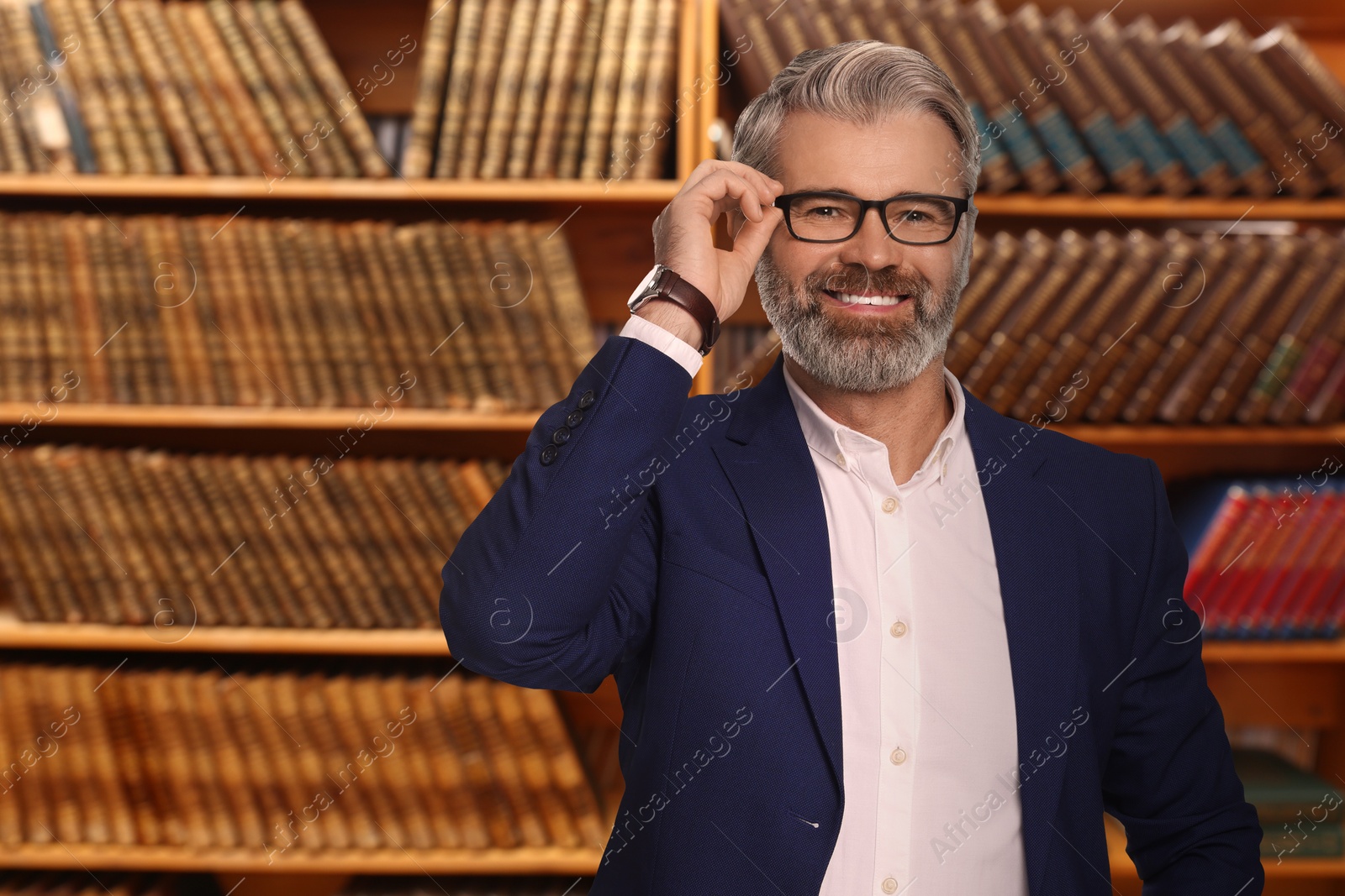 Image of Successful lawyer against shelves with books, space for text