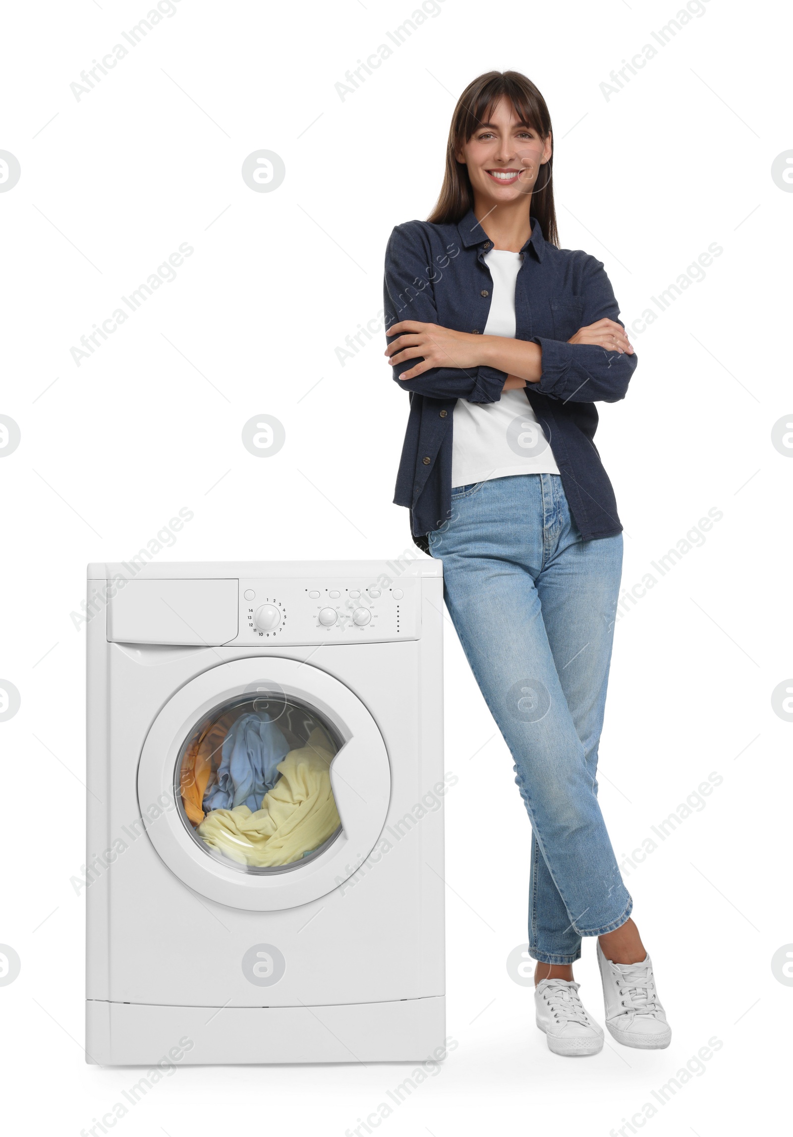 Photo of Beautiful woman near washing machine on white background