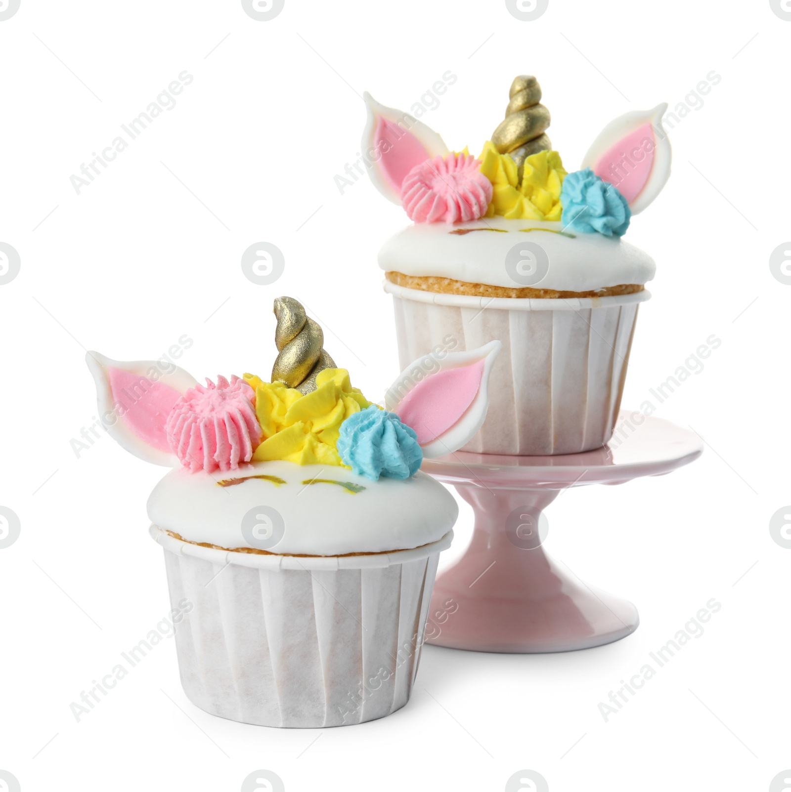 Photo of Cute sweet unicorn cupcakes on white background