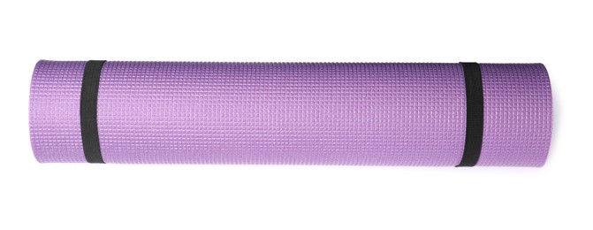 Photo of Violet rolled camping or exercise mat on white background, top view