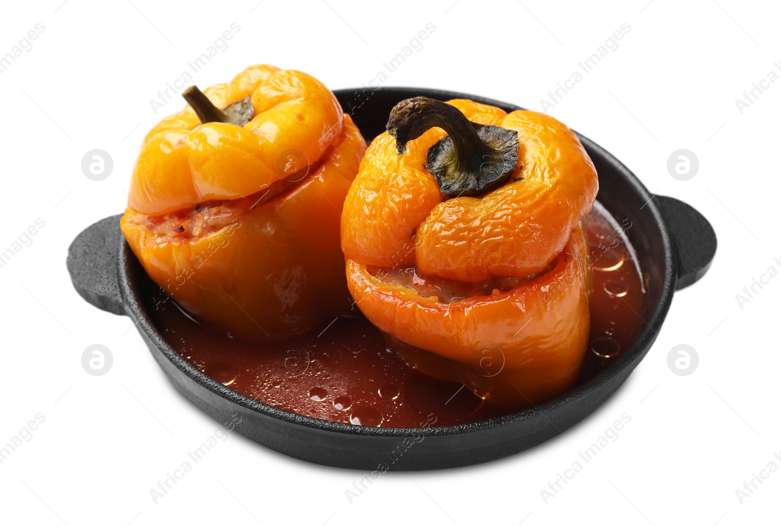 Photo of Tasty stuffed peppers in pan isolated on white