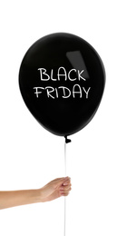 Woman holding balloon with text BLACK FRIDAY on white background, closeup