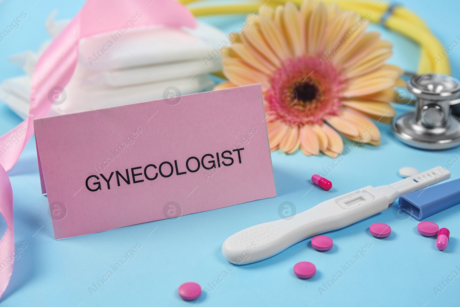 Photo of Composition with pregnancy test and pills on color background. Gynecological checkup