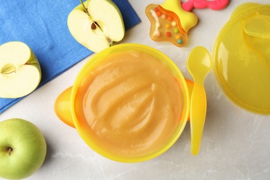 Photo of Bowl of healthy baby food on light table