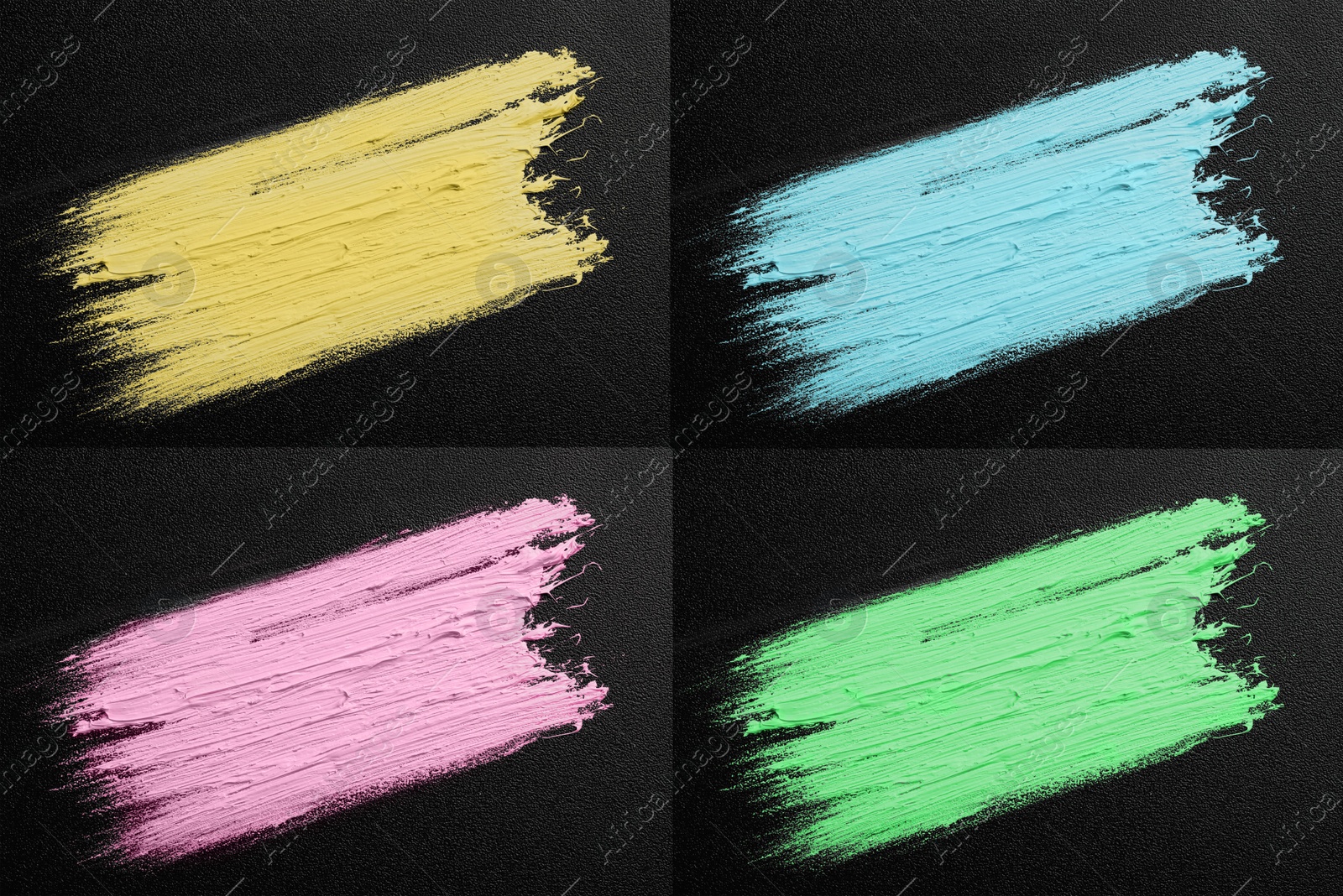 Image of Set with strokes of different oil paints on black canvas, top view 