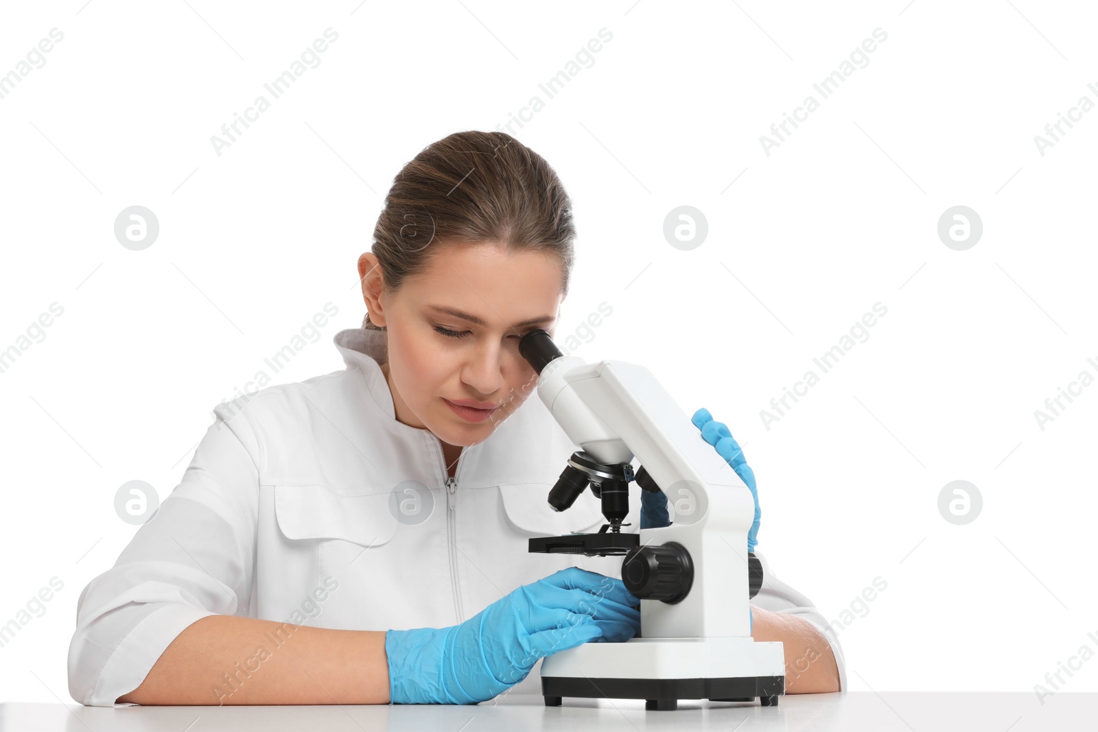 Photo of Scientist using modern microscope at table isolated on white. Medical research