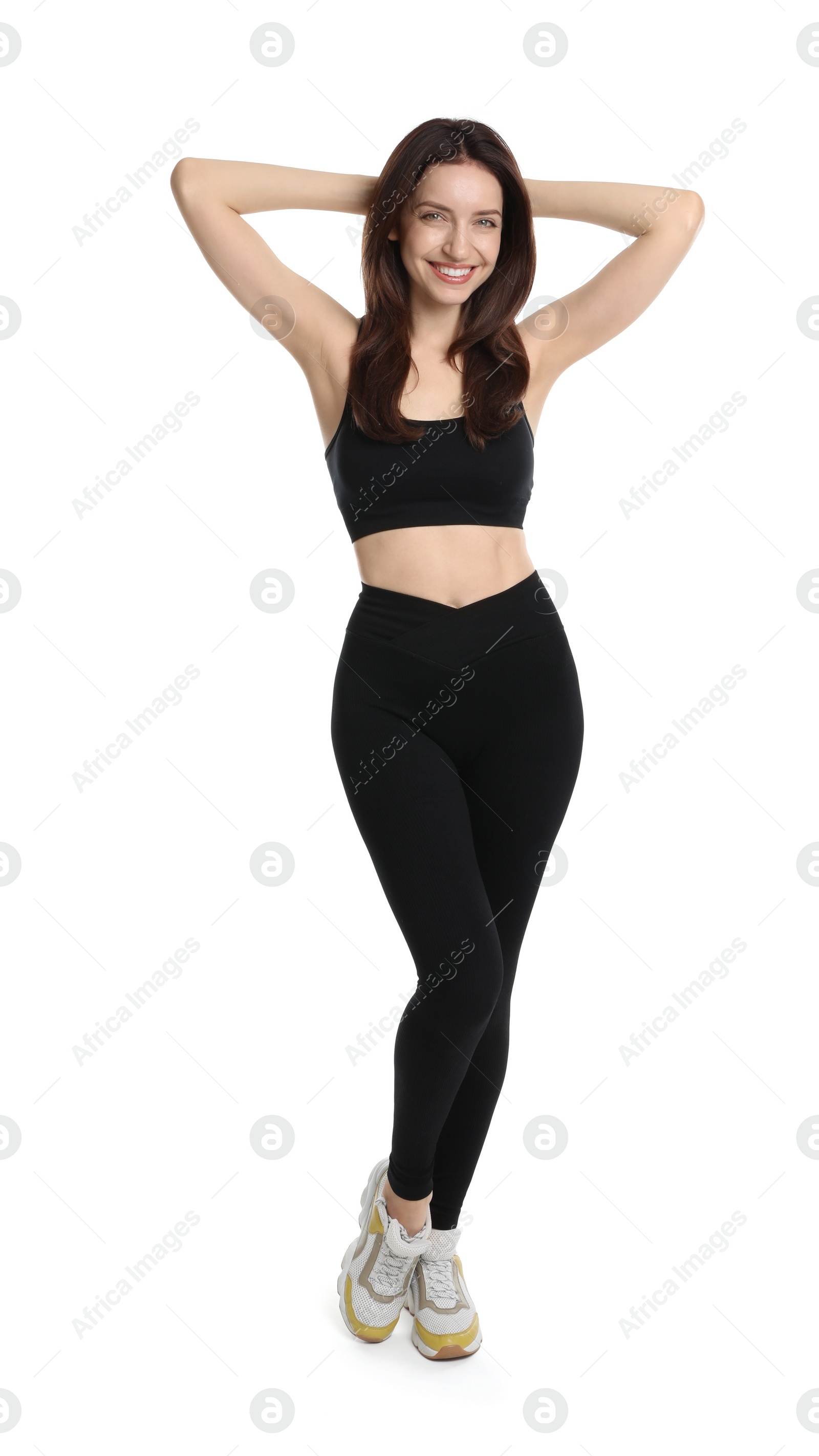 Photo of Happy young woman with slim body posing on white background