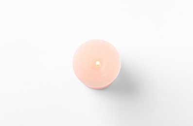 Pink candle isolated on white, top view