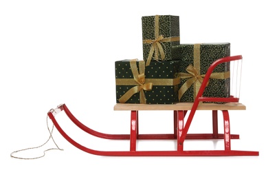 Photo of Sleigh with Christmas gifts isolated on white