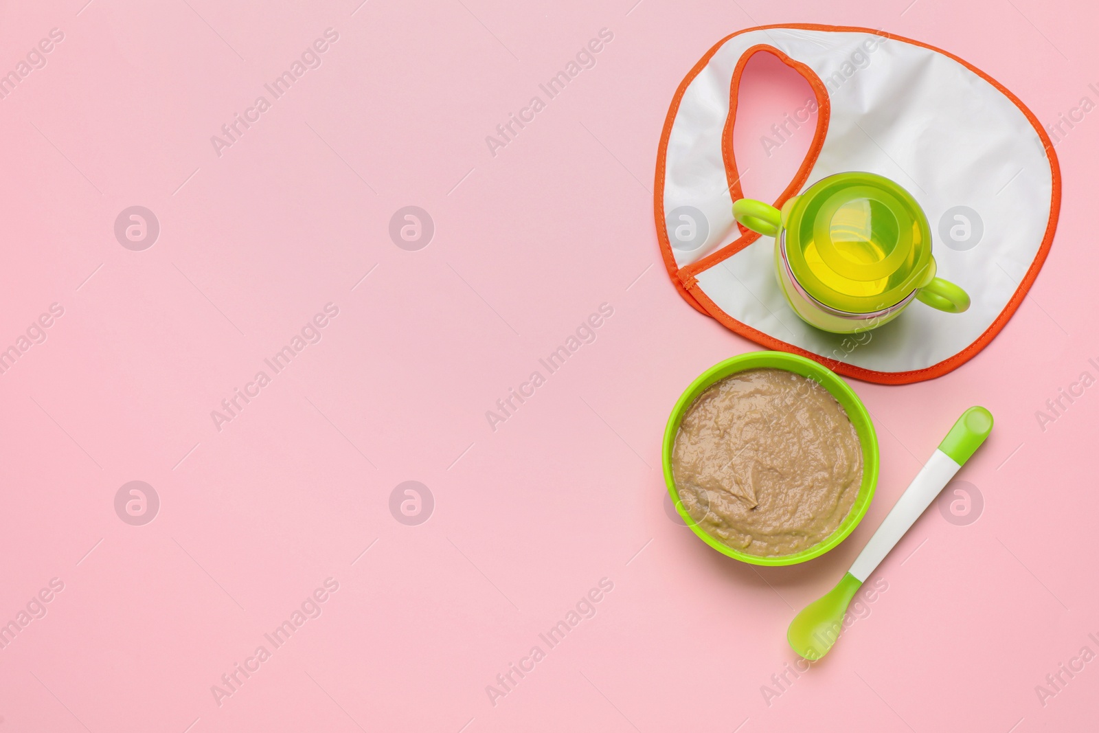 Photo of Healthy baby food in bowl and bottle with drink on pink background, flat lay. Space for text