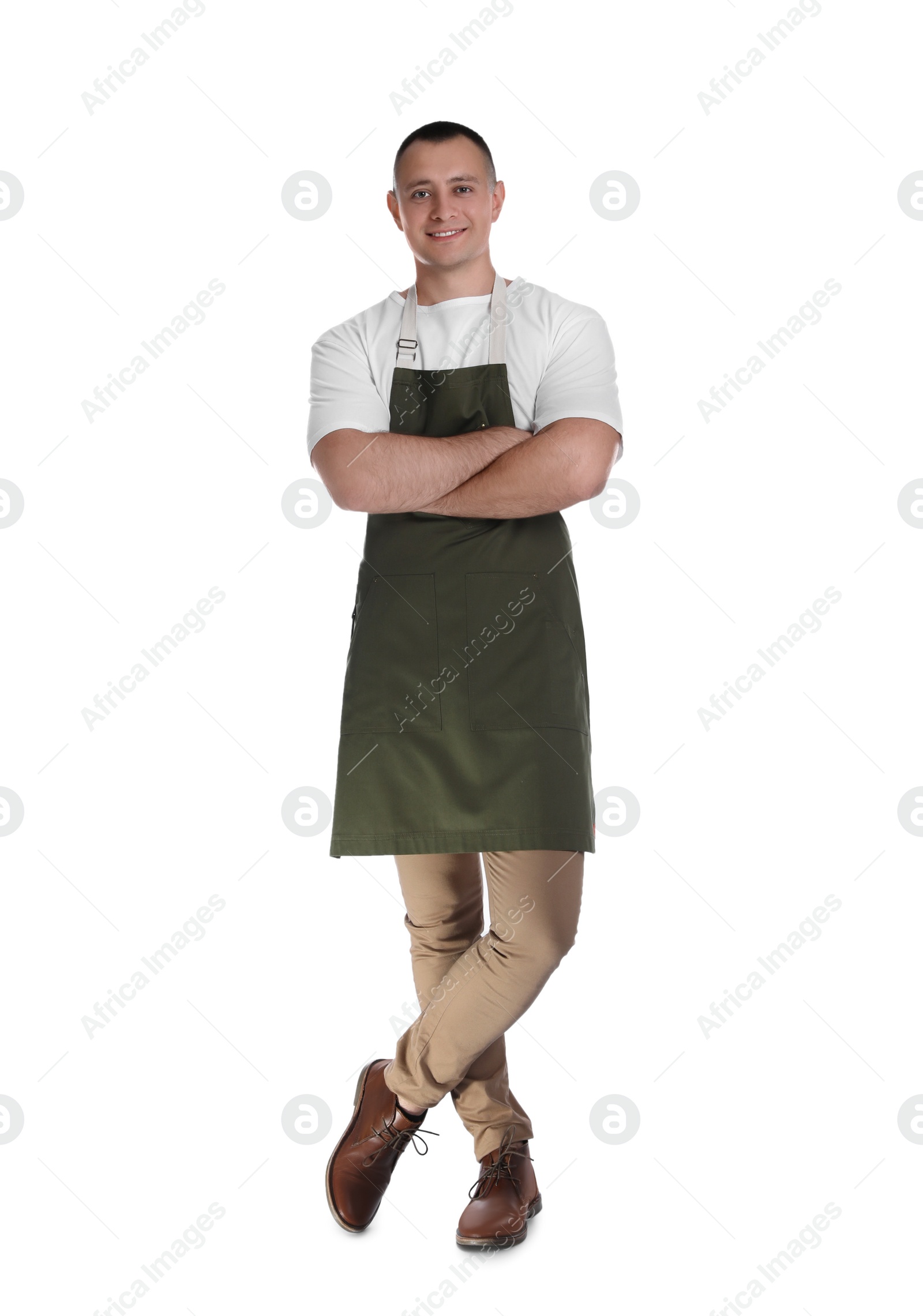 Photo of Full length portrait of happy young waiter in uniform on white background