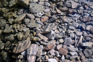 Stones and pebbles on bottom of river