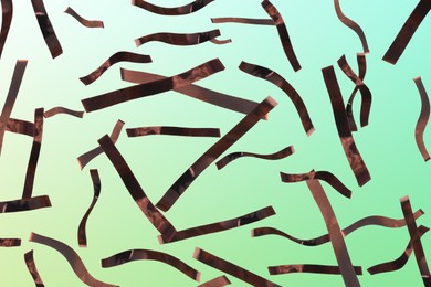 Image of Shiny bronze confetti falling on gradient green background