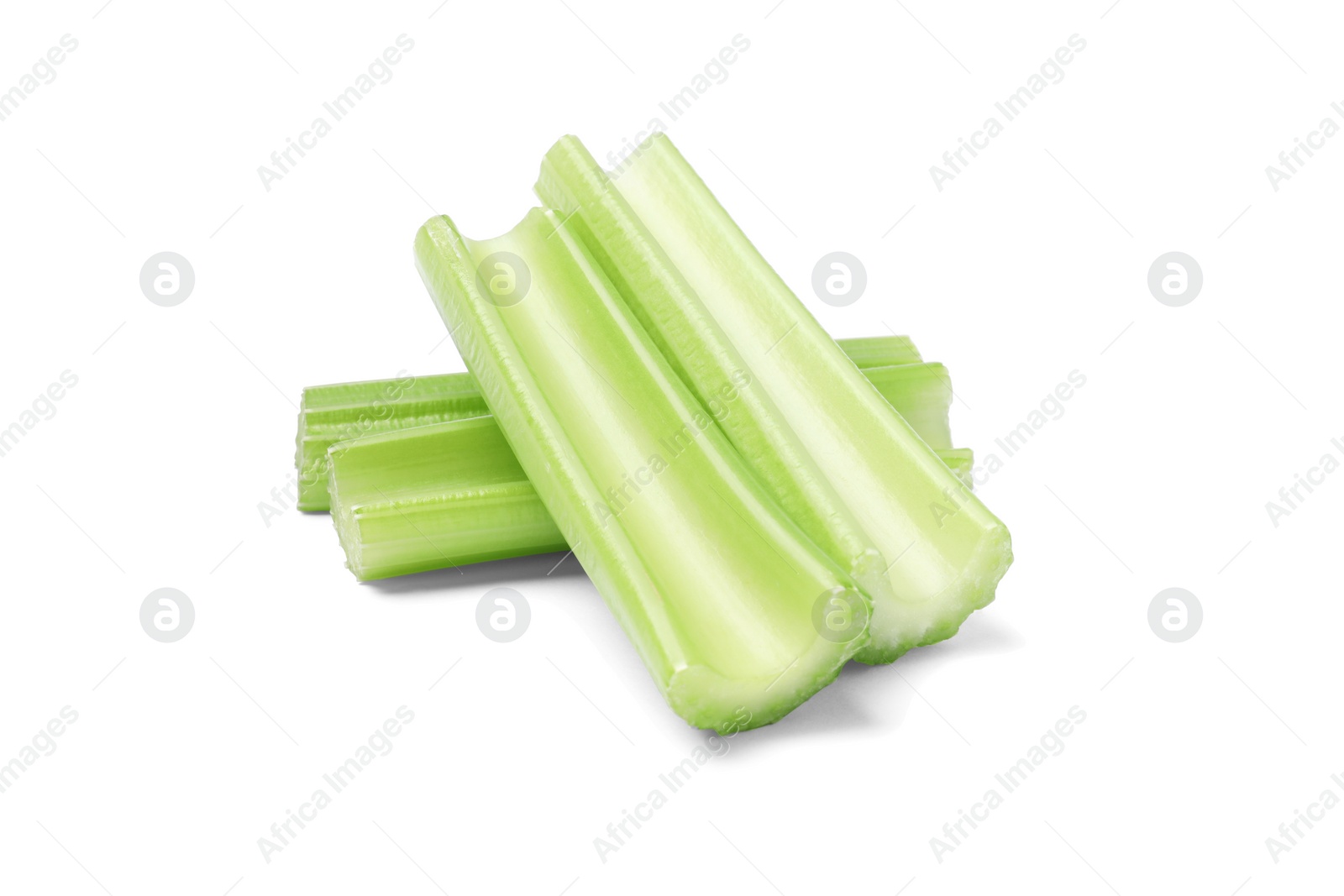 Photo of Fresh green cut celery isolated on white