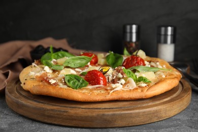 Photo of Delicious homemade pita pizza on grey table