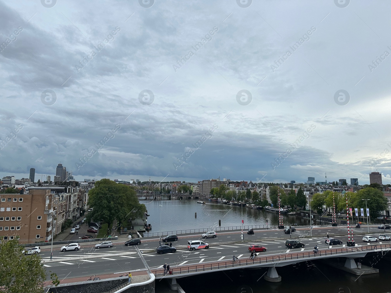 Photo of Amterdam, Netherlands - September 22, 2023: Beautiful view on city under cloudy sky