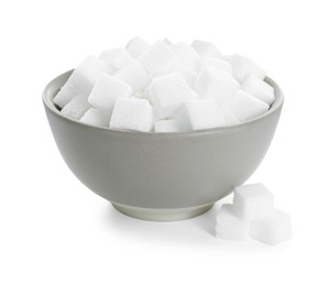 Photo of Sugar cubes in bowl isolated on white