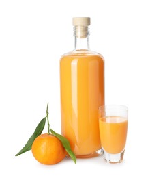 Photo of Tasty tangerine liqueur and fresh fruit isolated on white