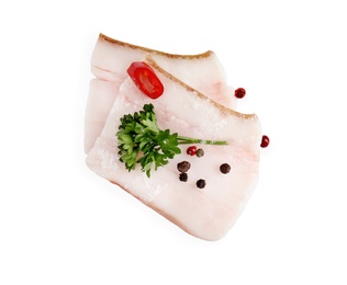 Slices of pork fatback with spices isolated on white, top view