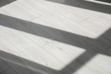 Photo of Shadow from window on white laminated floor