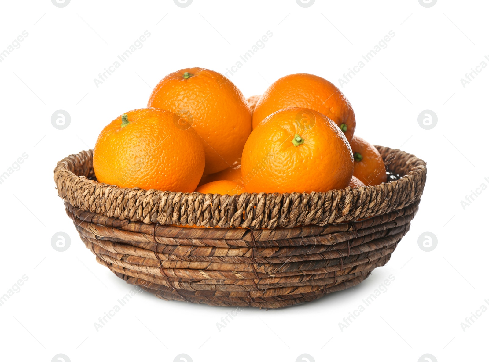 Photo of Fresh ripe oranges in wicker bowl isolated on white