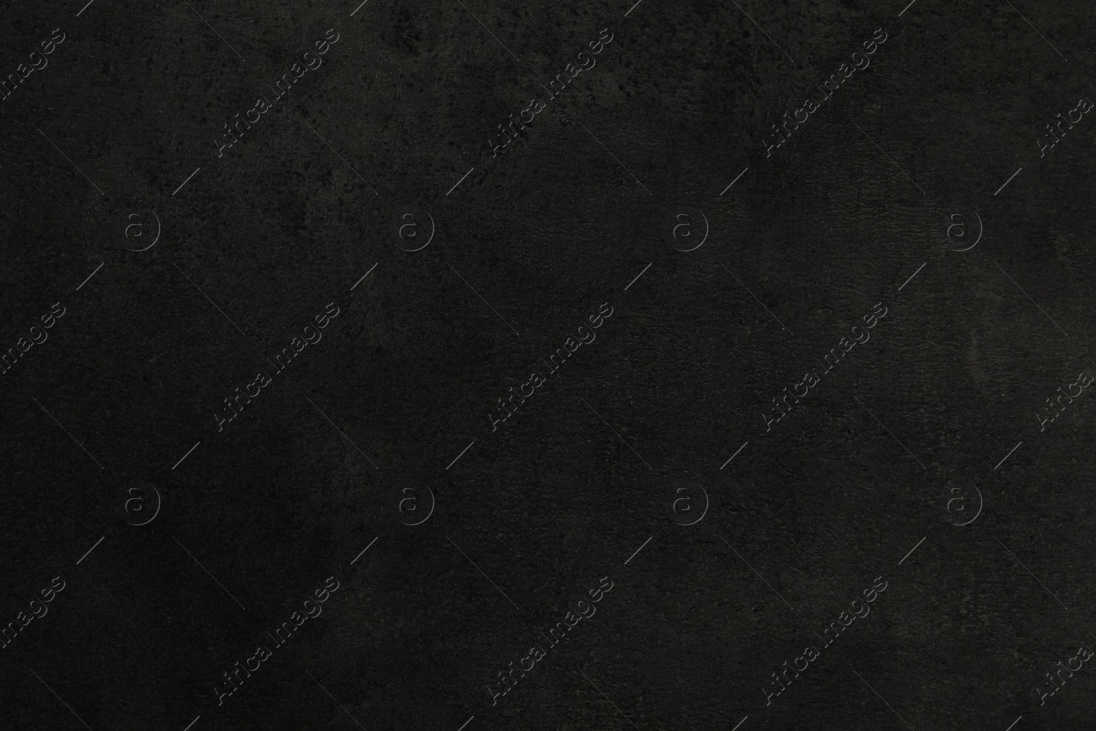 Photo of Texture of black stone surface as background, closeup