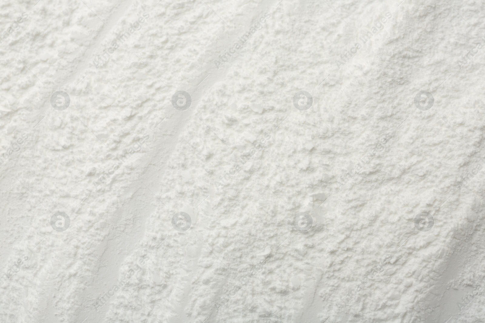 Photo of Texture of baking powder as background, top view