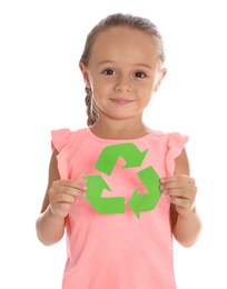 Photo of Little girl with recycling symbol on white background