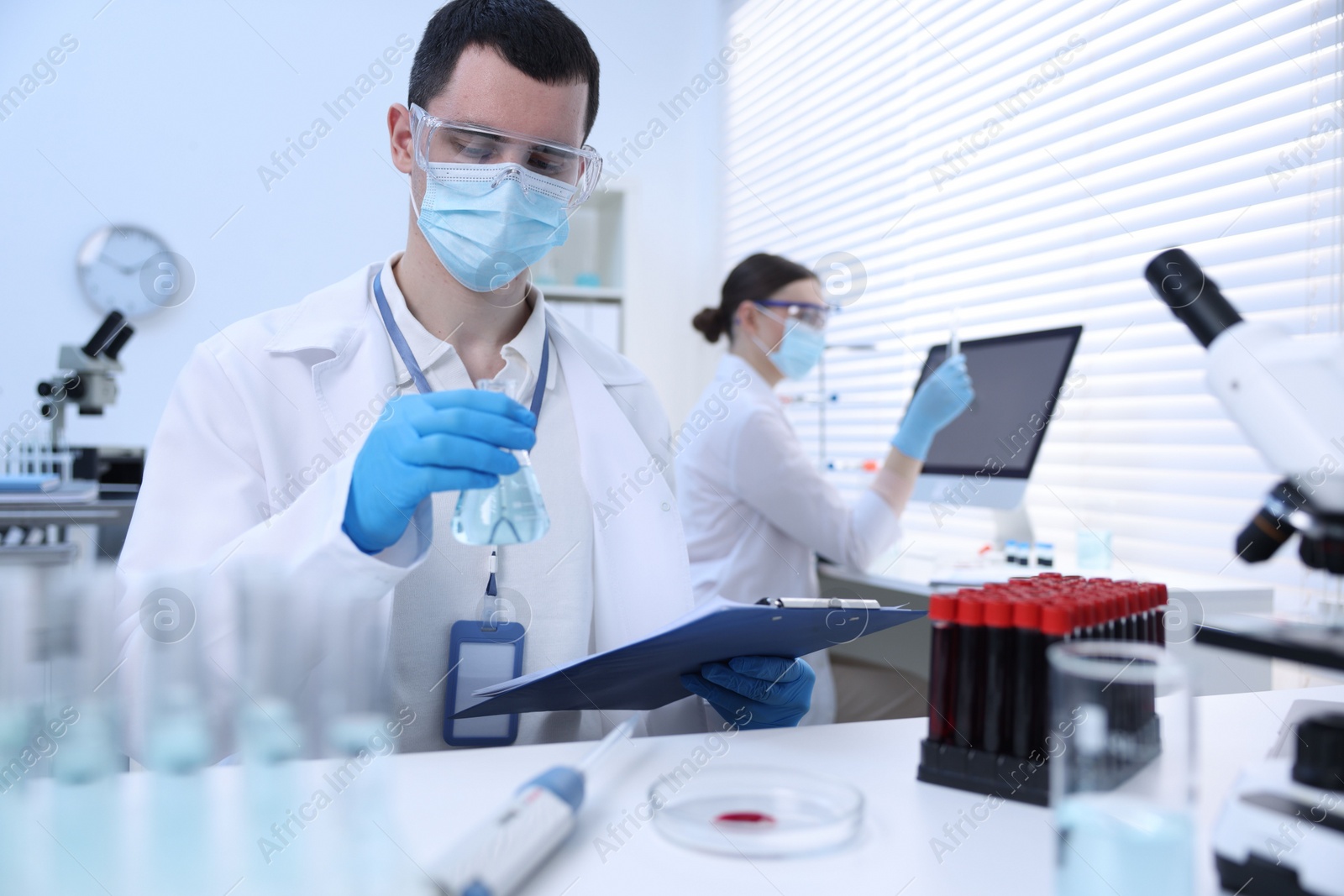 Photo of Scientists working with samples in laboratory. Medical research